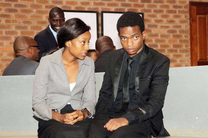 Rapper Booby East and his co-accused Ruth Mukanga, with their lawyer Osborn Ngoma, at the Lusaka Magistrates' Court on Monday before they were convicted of producing an obscene video.